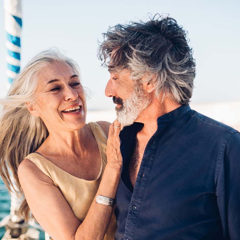 an older couple on a boat smiling after getting hormone therapy in Virginia Beach