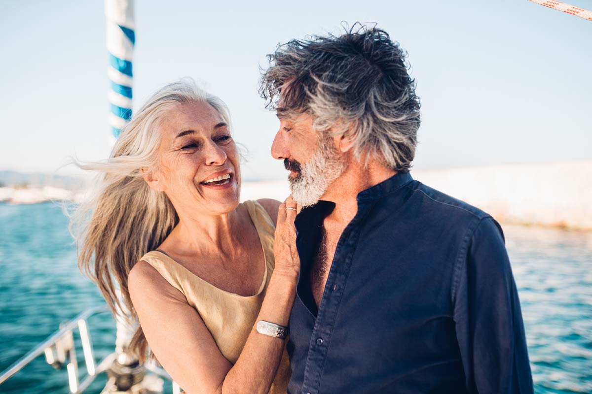 an older couple on a boat smiling after getting hormone therapy in Virginia Beach